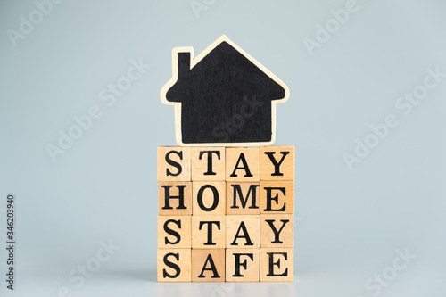 Social media awareness campaign and coronavirus prevention concept with word "STAY HOME STAY SAFE" on gray background.