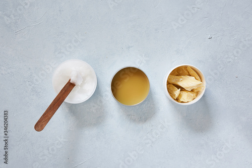 Natural ingredients and accessories for diy cosmetics and home spa treatment on turquoise background, top view.