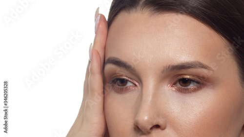 Macro shot of beautiful kari woman eye with extremely long eyelashes. Sexy and sensual gaze into the camera. Female eyes with perfectly smooth eyebrows. Permanent makeup and tattoo