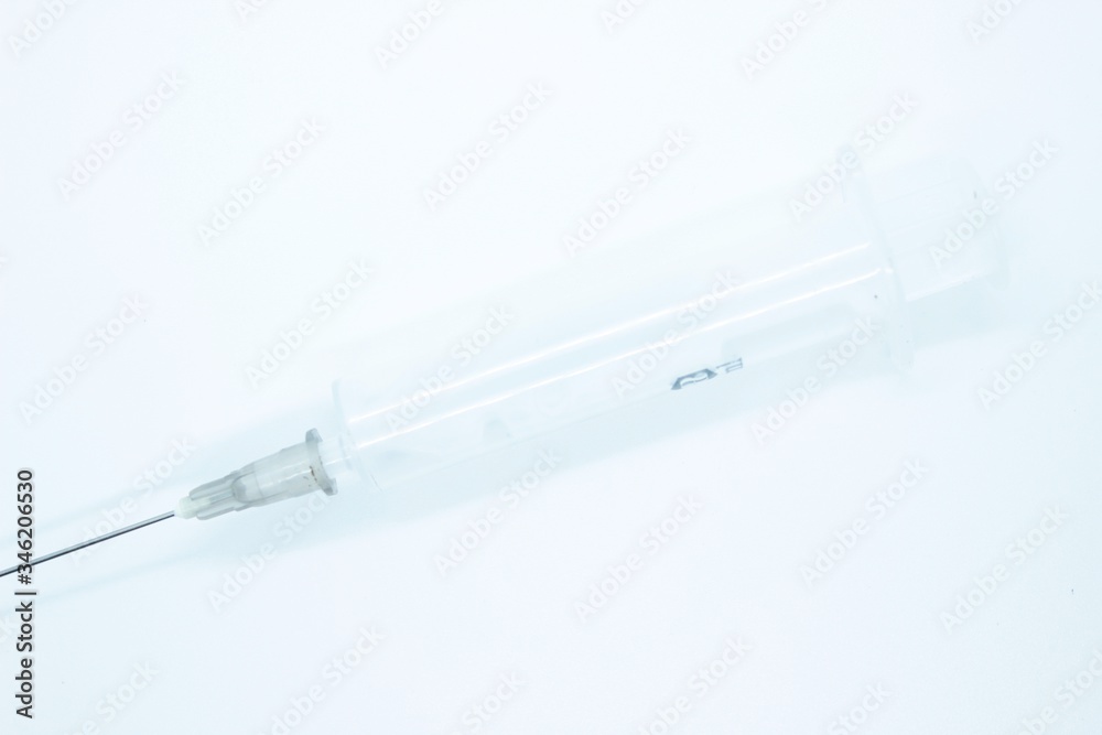 A non-breeding medical syringe for inyctions located on a white background A non-breeding medical syringe for inyctions located on a white background