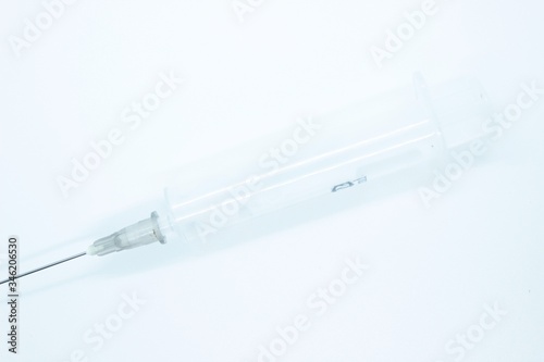 A non-breeding medical syringe for inyctions located on a white background