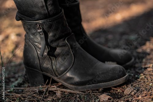 unisex black boots close-up photo