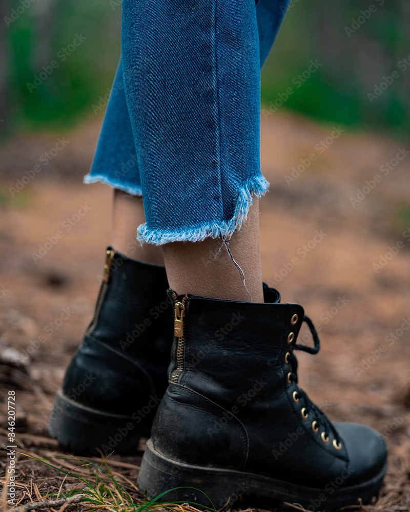unisex black boots close-up photo