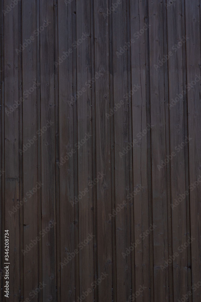 Naklejka premium Holzverkleidung dunkel vertikal