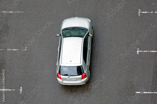 Silver car, car parking violation, top view 