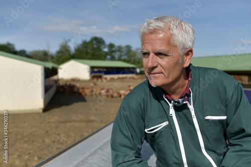 Obraz na plátně Portrait of farmer in poultry yard