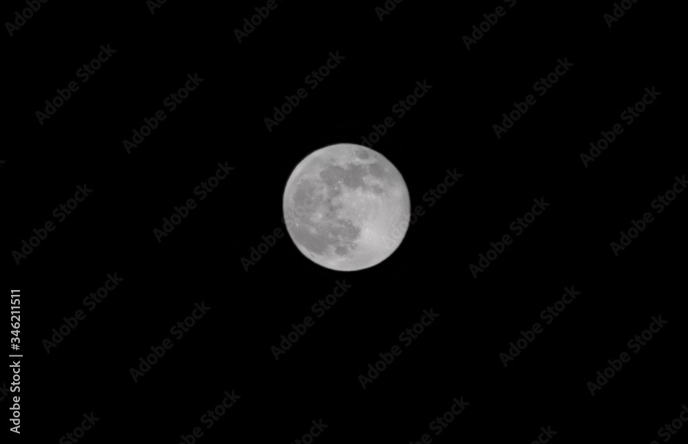 Moon glowing on black background. Moon glowing on black background.