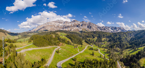 Aerail view of the Säntis (or Santis) mountain range landscape and schwägalp pass in Canton Appenzell in Switzerland on a sunny spring day photo