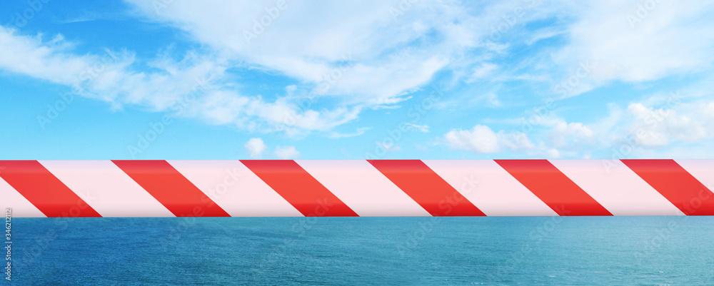 the water horizon is covered with a prohibition tape. Vacation is delayed the water horizon is covered with a prohibition tape. Vacation is delayed