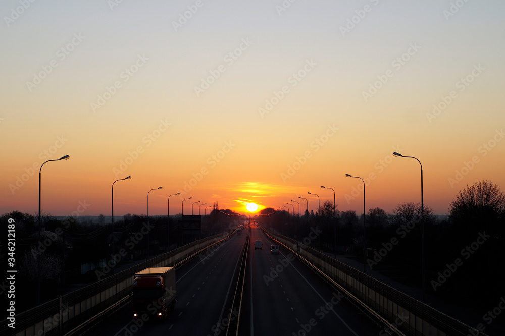 dawn and sunset on the road, transport at dawn, cars go to sunset