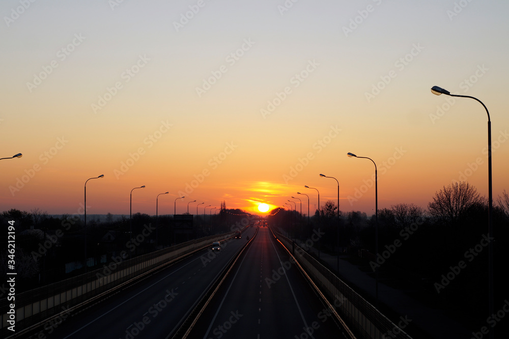 dawn and sunset on the road, transport at dawn, cars go to sunset