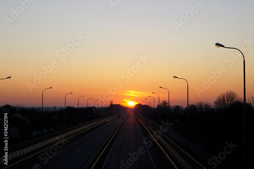 dawn and sunset on the road, transport at dawn, cars go to sunset