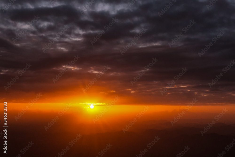 Sunset sunrise orange landscape in dramatic cloudy heaven sky aerial view