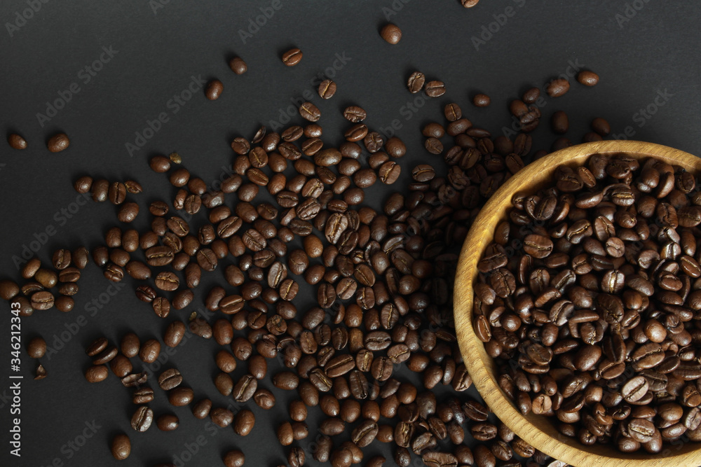 aromatic coffee beans in a wooden plate aromatic coffee beans in a wooden plate