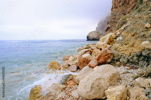 A dull day at the seaside among the rocks