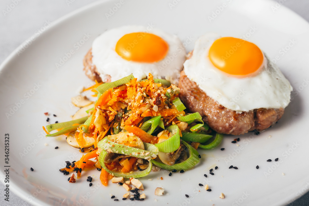 baked eggs and burgers meal with roasted vegetables baked eggs and burgers meal with roasted vegetables