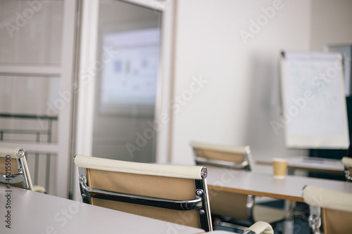 Chairs in a white conference room flapchart business