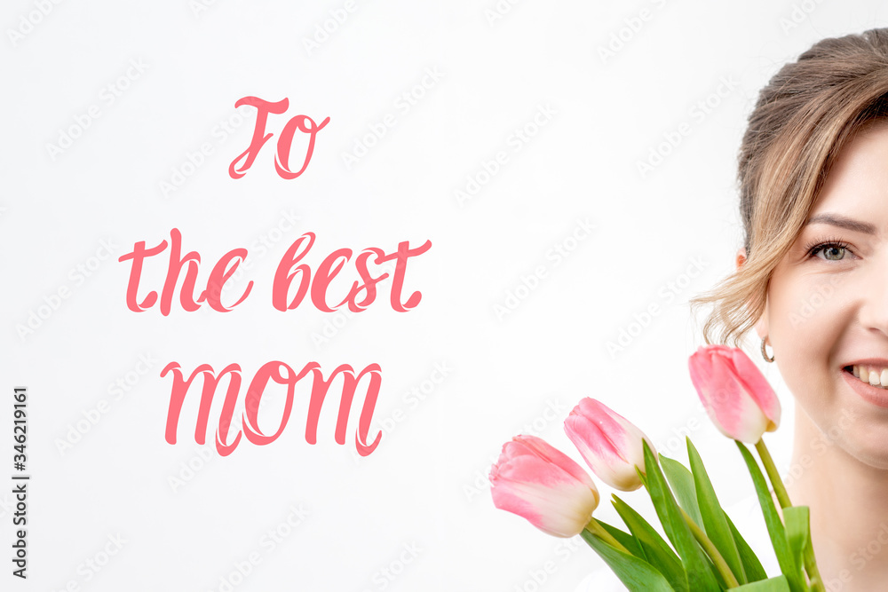 Half face portrait of beautiful woman with pink tulips on white background with text To The Best Mom.