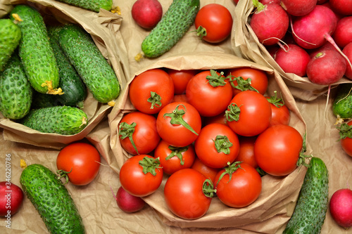 Fresh vegetables from farmers market. Cucumbers, tomatoes, radish. Pickle cucumbers. Organic vegetables. Salad ingredients.