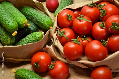 Fresh vegetables from farmers market. Cucumbers, tomatoes, radish. Pickle cucumbers. Organic vegetables. Salad ingredients.