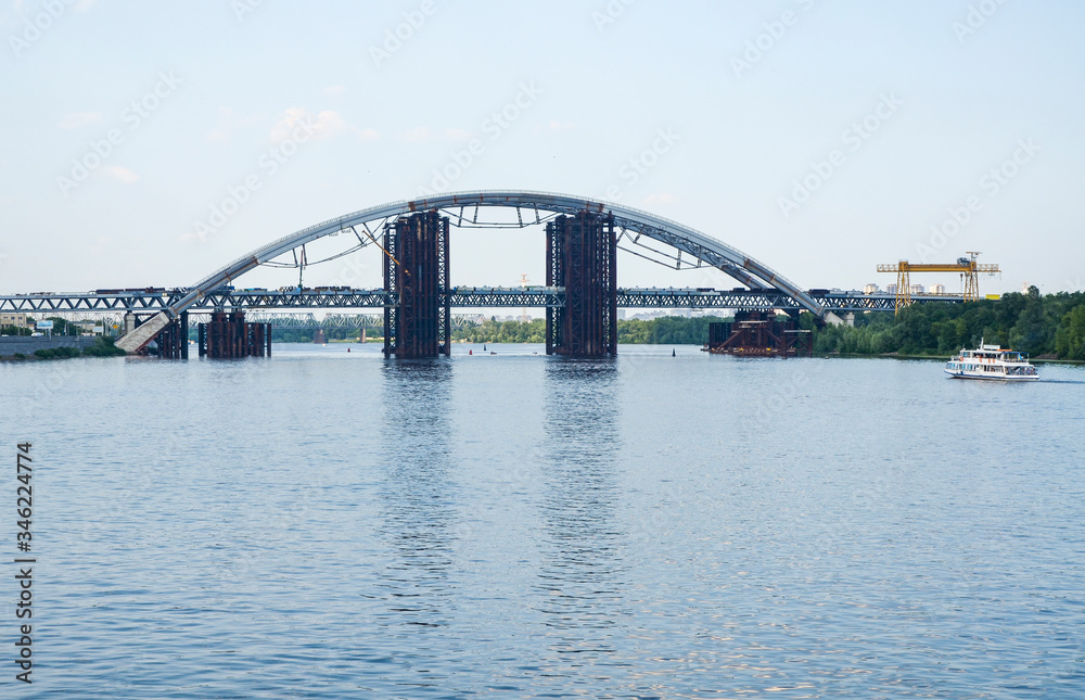 View of Podolsky Metro Bridge over the Dnipro river. This is a combined road-rail bridge under construction in Kyiv Ukraine