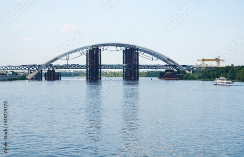 View of Podolsky Metro Bridge over the Dnipro river. This is a combined road-rail bridge under construction in Kyiv Ukraine © Dmytro