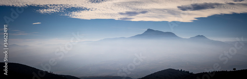 panoramic view from the top of a whole valley, mountains, fog, rivers, etc © JuanFrancisco