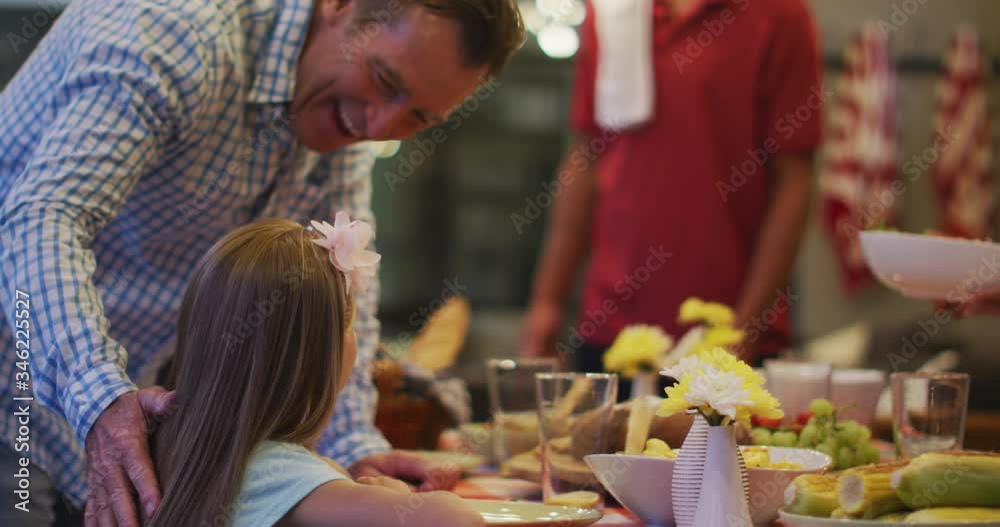 Happy family eating dinner together. Happy family eating dinner together.