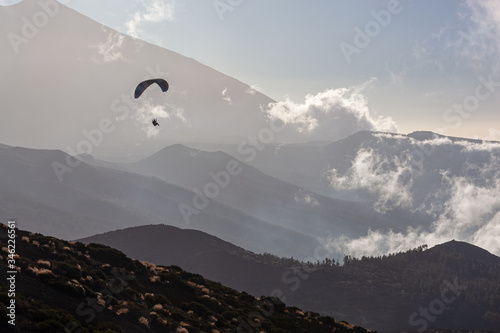 Paragliding above gorgeous mountains of Teide National Park, Tenerife, Canary Islands, Spain.
