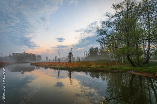 Fototapeta Naklejka Na Ścianę i Meble -  Foggy sunrise over the lake in Mazury region, Poland in impressionism style