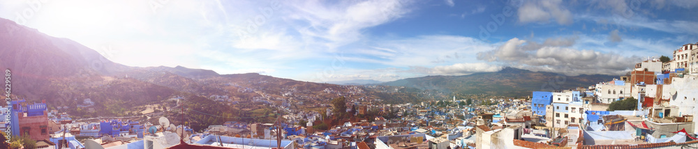 Panoramic view from the rooftop on Chefchaouen town, Morocco. Medina of the Blue city on sunset.