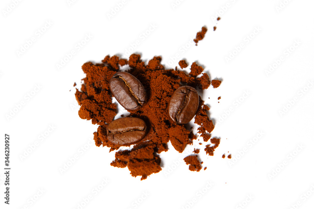 Fototapeta premium Ground coffee and roasted beans on a white background, isolated. Chocolate color of Robusta coffee.