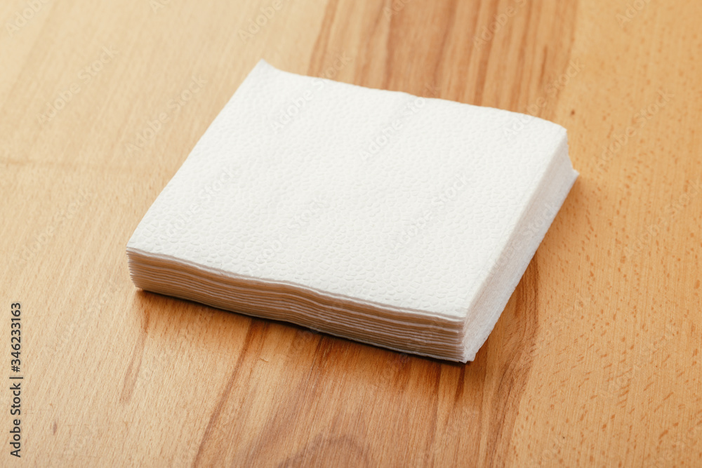 Fototapeta premium white paper napkin with a textured pattern on an old table