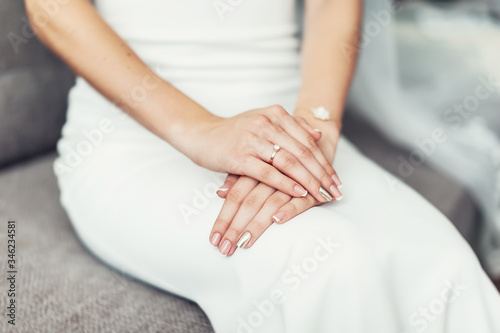 Close up of a brides hand on her lap