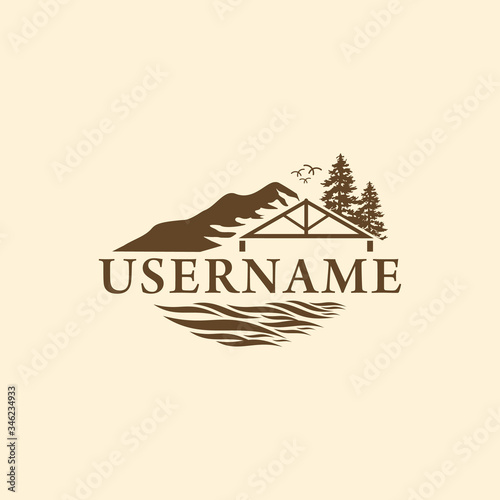 The logo of the inn with a rural atmosphere in the retro style mountains.
