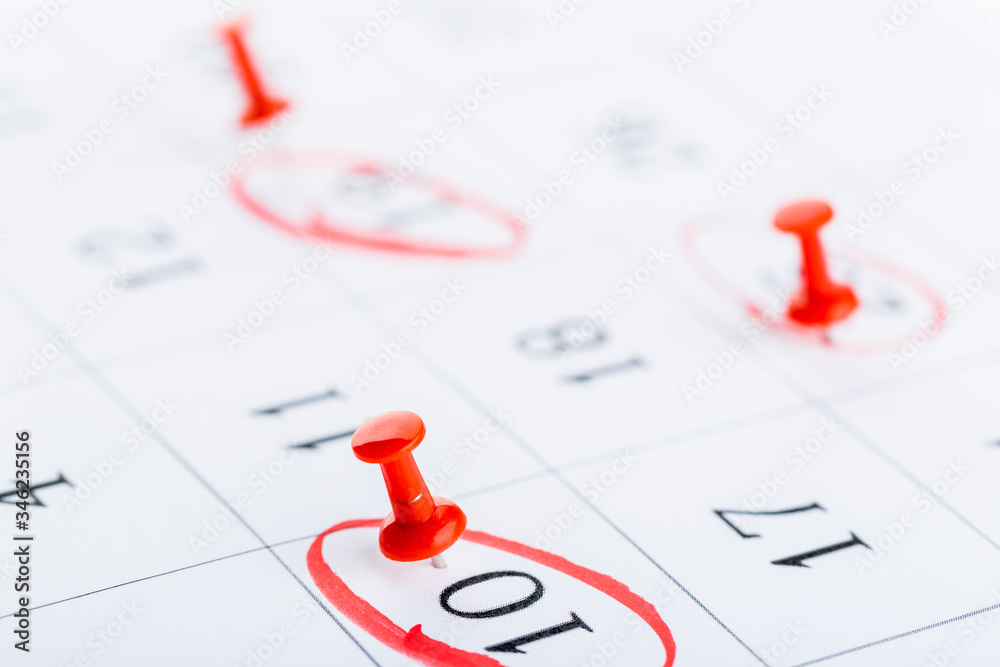 2020 calendar page marked with an important date in red pin. timeline, time, concept, idea, management 2020 calendar page marked with an important date in red pin. timeline, time, concept, idea, management