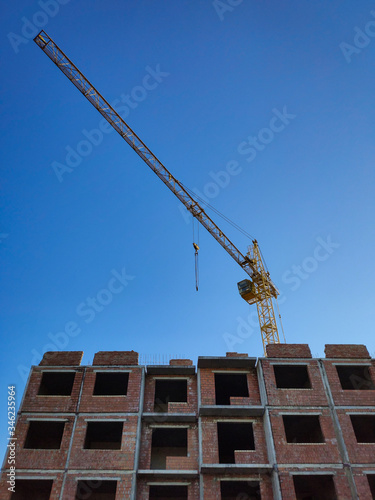 building under construction and crane
