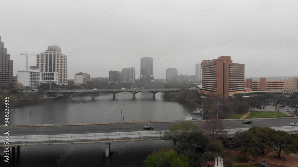 On a misty morning in Austin, Texas, a drone captures traffic crossing bridges over the Colorado River. On a misty morning in Austin, Texas, a drone captures traffic crossing bridges over the Colorado River.