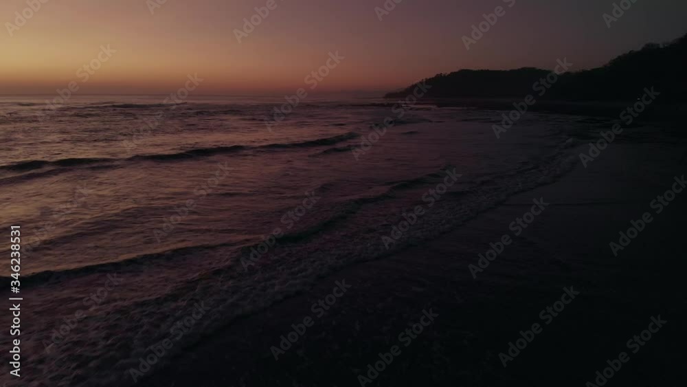 Sea Waves In Costa Rica Beach With A Beautiful Horizon At Dusk. - aerial drone shot Sea Waves In Costa Rica Beach With A Beautiful Horizon At Dusk. - aerial drone shot
