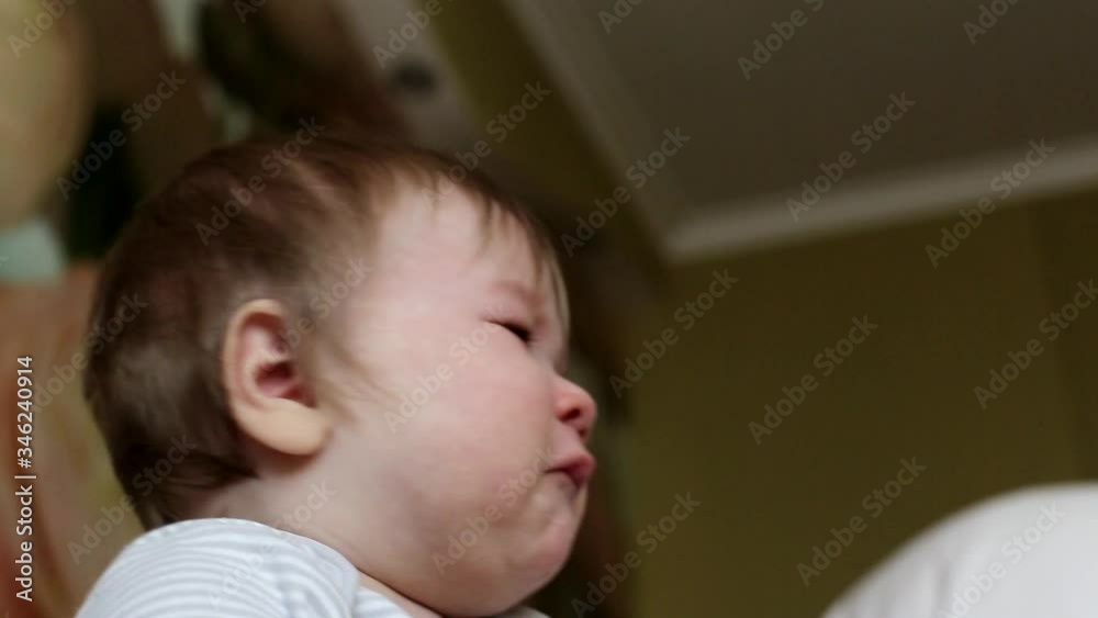 Caucasian little baby boy is offended and cries. Emotion of baby on the face, background Caucasian little baby boy is offended and cries. Emotion of baby on the face, background