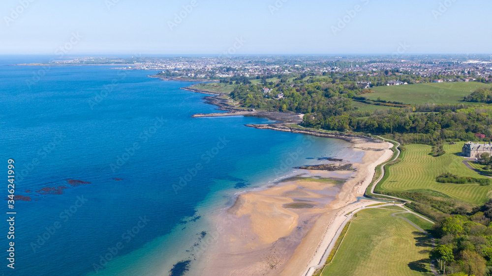 Aerial view of Coast of Irish Sea in Helen's Bay, Northern Ireland. View from above on beach in sunny day