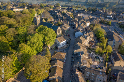 Aerial Shot of Haworth main street, near Keighley, West Yorkshire home of the Bronte Sisters, featuring St Michael & All Angels Church, where Maria Brontë, Patrick Brontë, Elizabeth Brontë, are buried photo