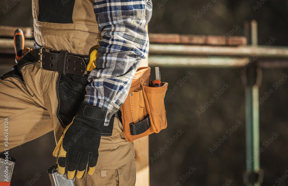 Close Up Of Construction Laborer With Tool Belt Around Waist. Close Up Of Construction Laborer With Tool Belt Around Waist.