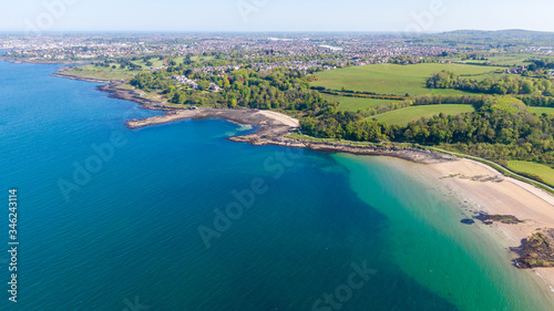 Fototapeta Naklejka Na Ścianę i Meble -  Aerial view of Coast of Irish Sea in Helen's Bay, Northern Ireland. View from above on beach in sunny day