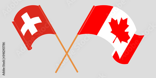 Crossed and waving flags of Switzerland and Canada