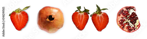 Set of juicy halves of strawberries and pomegranates on a white background. photo
