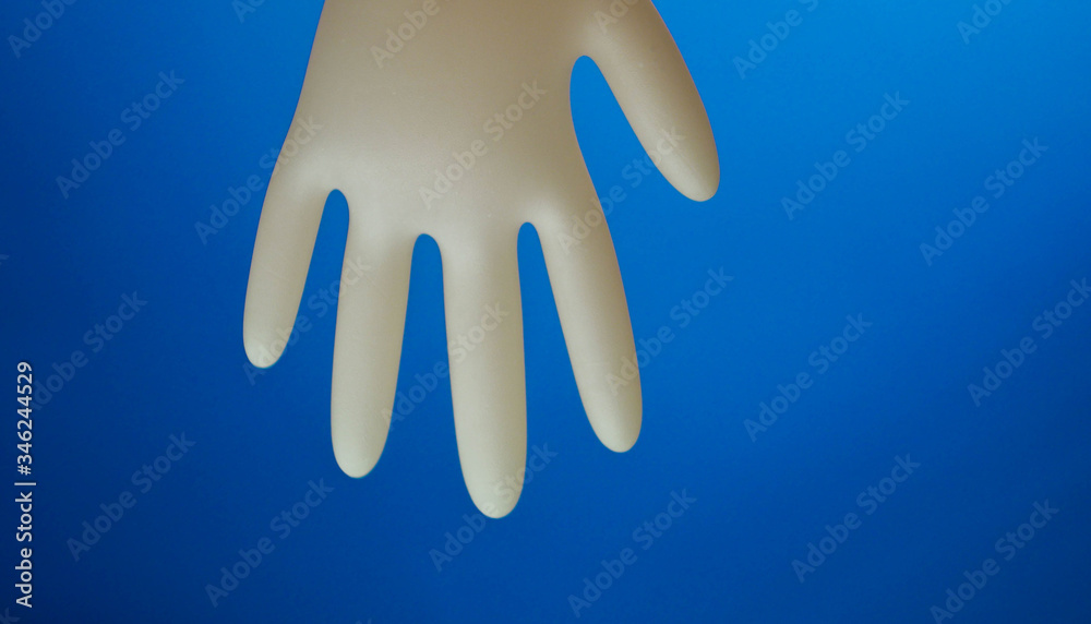 Funny character made of rubber glove. Copy space. Medicine for kids. Medical gloves. Entertain children at hospital Funny character made of rubber glove. Copy space. Medicine for kids. Medical gloves. Entertain children at hospital