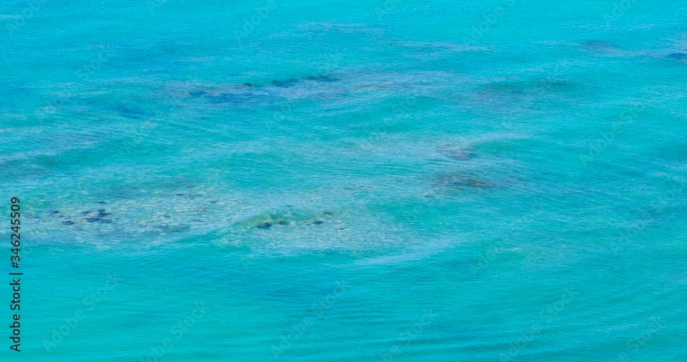 Pollution floating on turquoise sea water of shallow lagoon putting in danger sea species Pollution floating on turquoise sea water of shallow lagoon putting in danger sea species