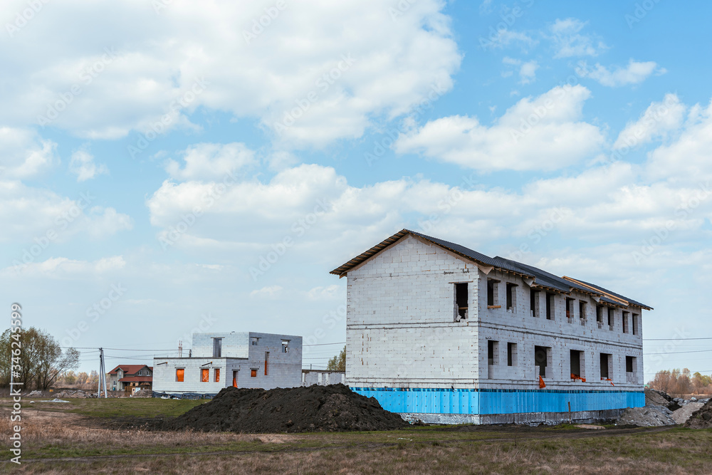 Building house (uncompleted) - with blue sky Building house (uncompleted) - with blue sky
