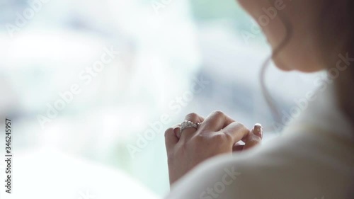 Wallpaper Mural The bride looks at the engagement ring on her finger with pleasure. Torontodigital.ca